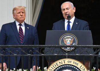 US President Donald Trump watches as Israeli Prime Minister Benjamin Netanyahu (R) speaks from the Truman Balcony at the White House during the signing ceremony of the Abraham Accords where the countries of Bahrain and the United Arab Emirates recognize Israel, on the South Lawn of the White House in Washington, DC, September 15, 2020. - Israeli Prime Minister Benjamin Netanyahu and the foreign ministers of Bahrain and the United Arab Emirates arrived September 15, 2020 at the White House to sign historic accords normalizing ties between the Jewish and Arab states. (Photo by SAUL LOEB / AFP)