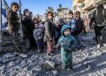 Children stand amid the rubble of a mosque and makeshift shelters that were destroyed in Israeli strikes in Deir al-Balah in central Gaza on March 2, 2024, as battles continue between Israel and the Palestinian militant group Hamas. (Photo by AFP)